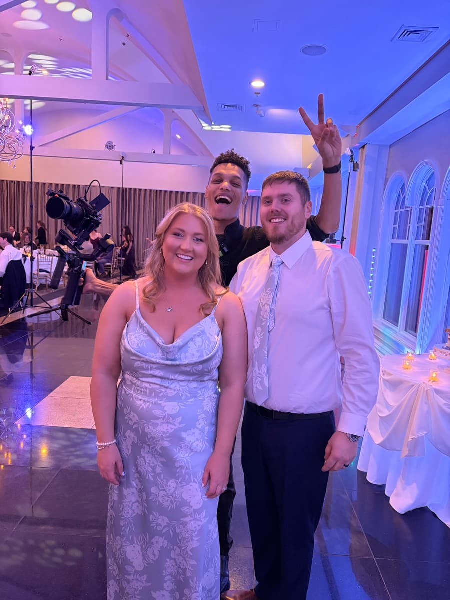 Skytona team member taking a photo with a wedding client