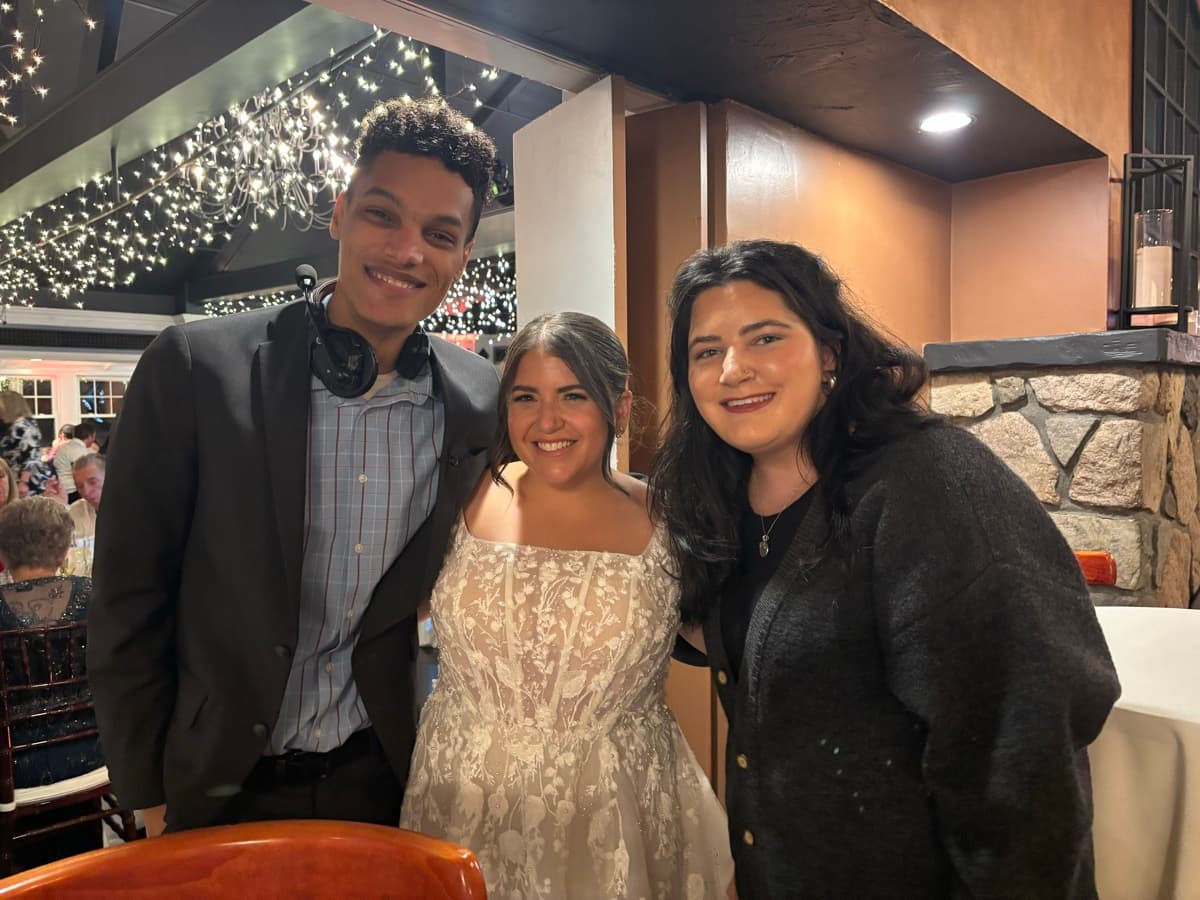 Skytona team standing with a bride