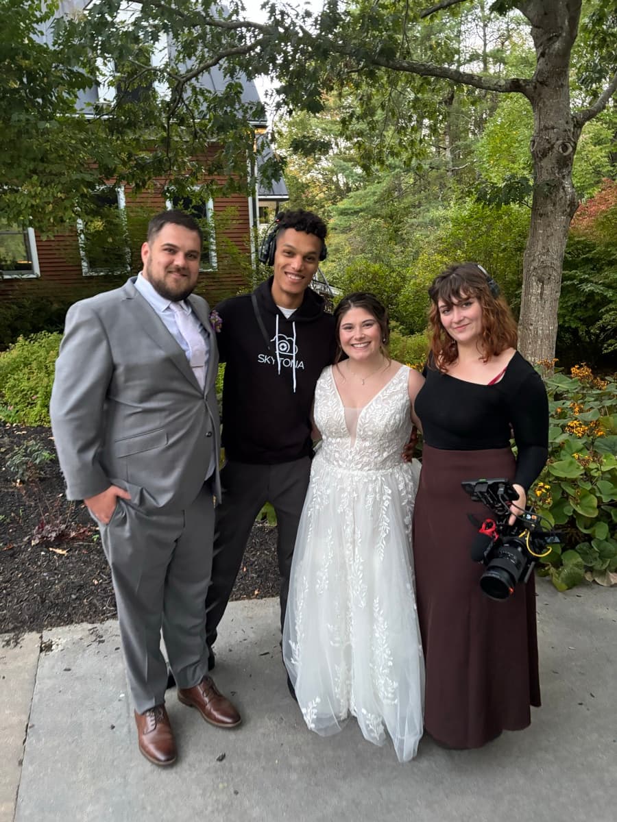 Skytona team with wedding clients at a reception